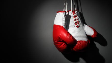 Boxing Gloves Hanging in Shadows wallpaper