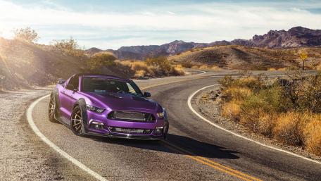 Stunning Purple Sports Car on Winding Road wallpaper