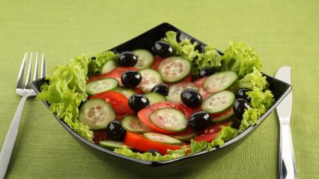 Fresh and Colorful Garden Salad Delightful Salad in a Black Bowl with Greens and Veggies wallpaper