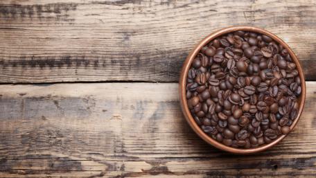 Rich Coffee Beans on Rustic Wood Surface wallpaper