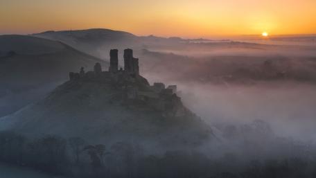 Mystical Dawn Over Ancient Ruins wallpaper
