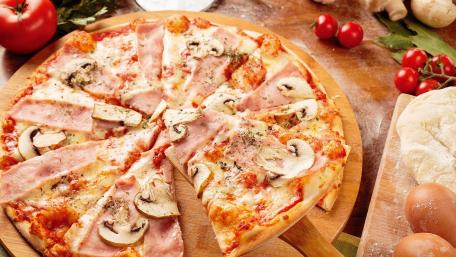 Delicious Pizza with Fresh Ingredients and Toppings wallpaper