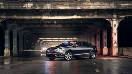 Urban Night Drive with a Sleek Sedan wallpaper