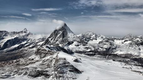 Majestic Snow-Capped Mountain Range Views wallpaper