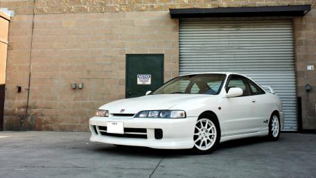 Sleek White Sports Car in Urban Setting wallpaper
