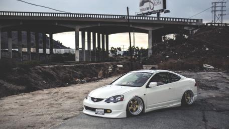 Sleek White Car in Urban Setting wallpaper