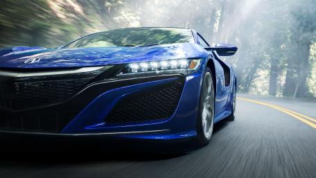 Sleek Blue Supercar on a Forest Road wallpaper