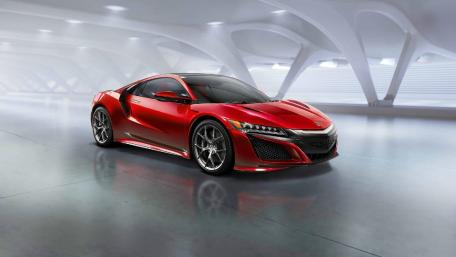 Sleek Red Supercar in Modern Setting wallpaper