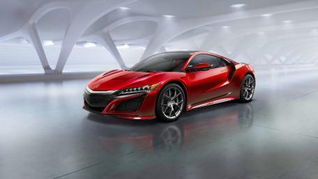 Sleek Red Sports Car in Modern Setting wallpaper