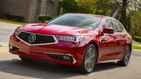 Sleek Red Sedan in Motion wallpaper