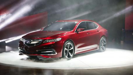 Sleek Red Luxury Car in Spotlight wallpaper