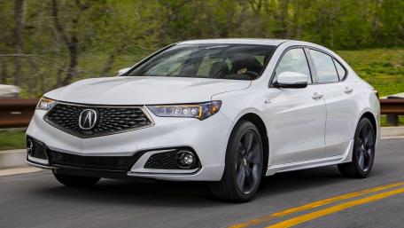 Sleek and Stylish Acura Driving Through Scenic Route wallpaper