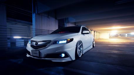 Sleek White Car in Urban Setting wallpaper