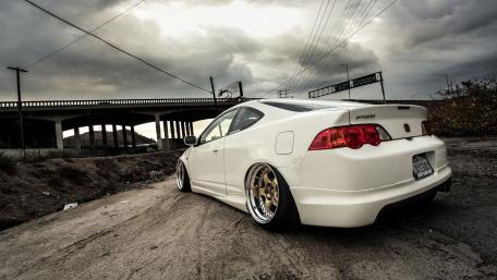 Sleek Urban Ride with Dramatic Skies wallpaper