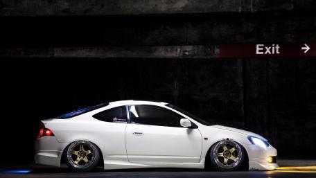 Sleek White Car in Urban Setting wallpaper