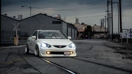 Sleek White Honda on Abandoned Tracks wallpaper