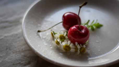 Refreshing Cherries on a White Plate wallpaper
