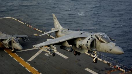 Military Jets Taking Off from Aircraft Carrier Deck wallpaper