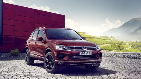 Sleek Volkswagen SUV Against Scenic Background wallpaper