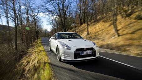 Sleek Performance on Open Roads wallpaper