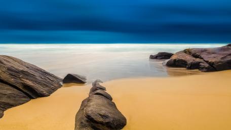Serene Beachscape Under a Mystical Sky wallpaper
