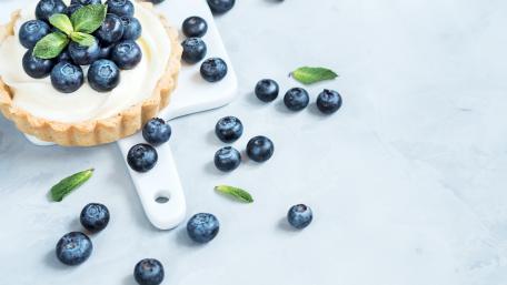 Delicious Blueberry Tart on a Light Surface wallpaper