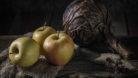 Charming Rustic Apples on Wooden Table wallpaper