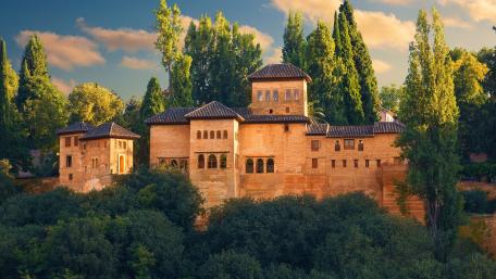 Majestic Fortress Surrounded by Lush Greenery wallpaper