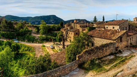 Rustic Charm of a Quaint Village Landscape wallpaper