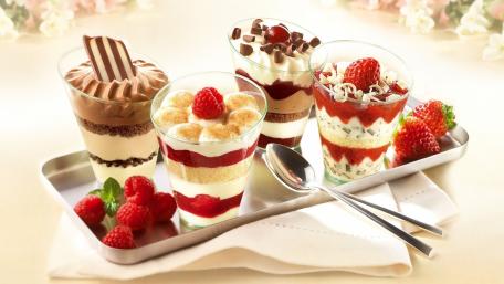 Delicious Dessert Delight Featuring Four Tantalizing Treats wallpaper