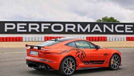 Racing Spirit in Vibrant Orange Car Wallpaper wallpaper