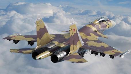 Fighter Jet in Flight Above the Clouds wallpaper
