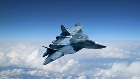 Futuristic Military Aircraft in Flight Above the Clouds wallpaper