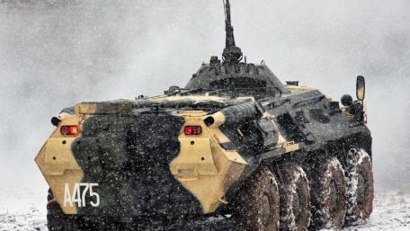 Military Vehicle in Snowy Terrain wallpaper