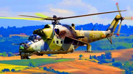 Military Helicopter in Action Over Scenic Landscape wallpaper