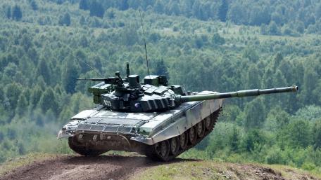 Powerful Tank in Action Amidst Nature's Serenity wallpaper