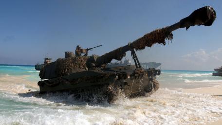 Military Power on the Shoreline Amidst Waves of Strength wallpaper