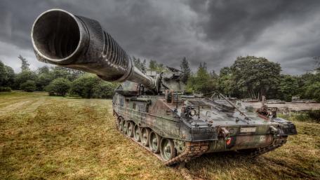Powerful Military Tank Under Dark Skies wallpaper