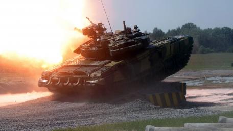 Dynamic Tank in Action Amid Explosive Scene wallpaper