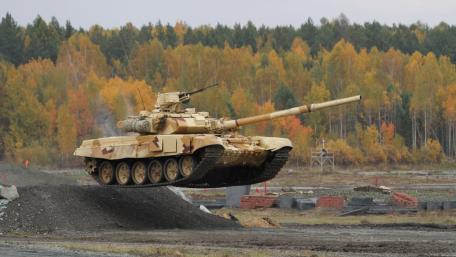 Dynamic Tank in Action Amidst Autumn Colors wallpaper