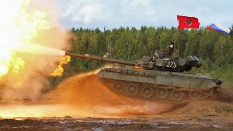 Powerful Tank on the Battlefield under Fiery Action wallpaper
