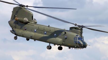Chinook Helicopter in Action Under Dramatic Skies wallpaper