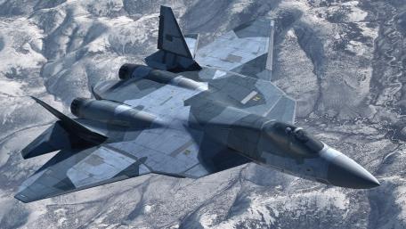 Fighter Jet Soaring Over Snowy Mountains wallpaper