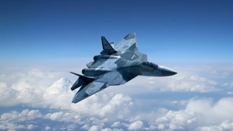Sleek Stealth Fighter in Action Above the Clouds wallpaper