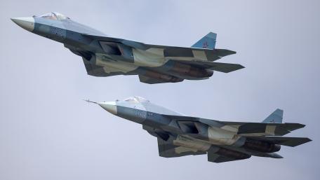 Modern Fighter Jets in Formation Flying Overhead wallpaper