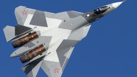 Futuristic Fighter Jet in Action wallpaper