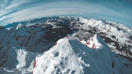 Majestic Snow-Capped Mountains Under a Clear Sky wallpaper