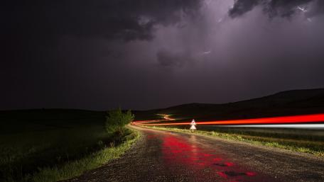 Stormy Night with Lightning Strikes and Light Trails wallpaper