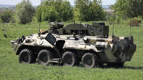 Military Armored Vehicle in a Scenic Setting wallpaper