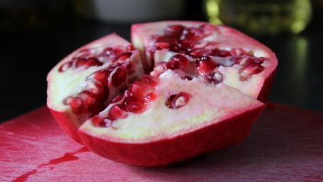Vibrant Fresh Pomegranate Close-Up Wallpaper wallpaper